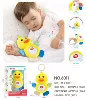 Appeases doll with light music, duck