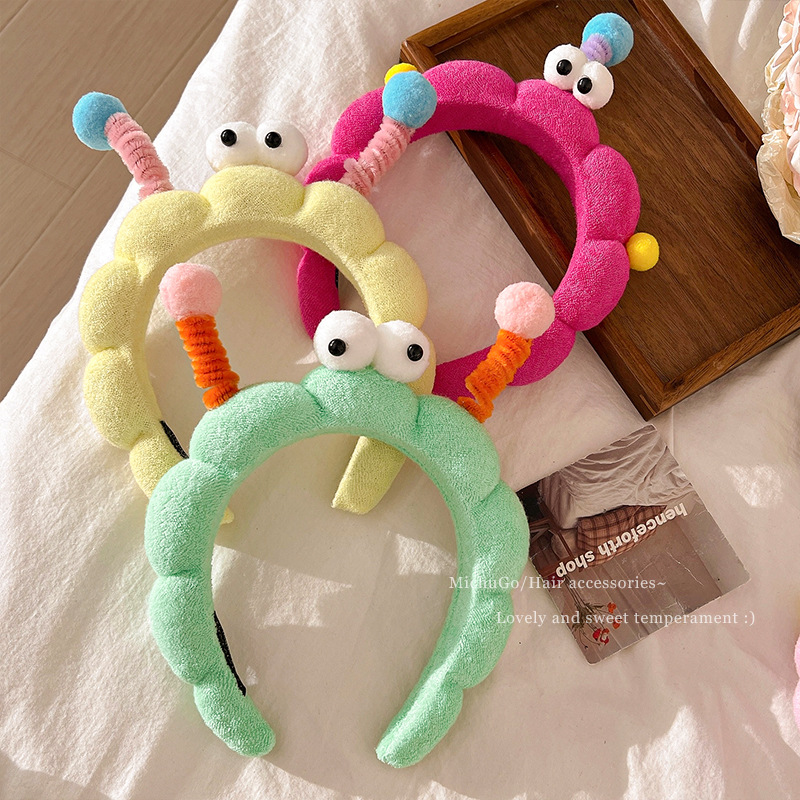 Divertido twist stick, ojos grandes esponja lavar la cara, banda de cabello en casa, sensación de niña lavar la cara, máscara, banda de cabello de presión, tarjeta de cabello