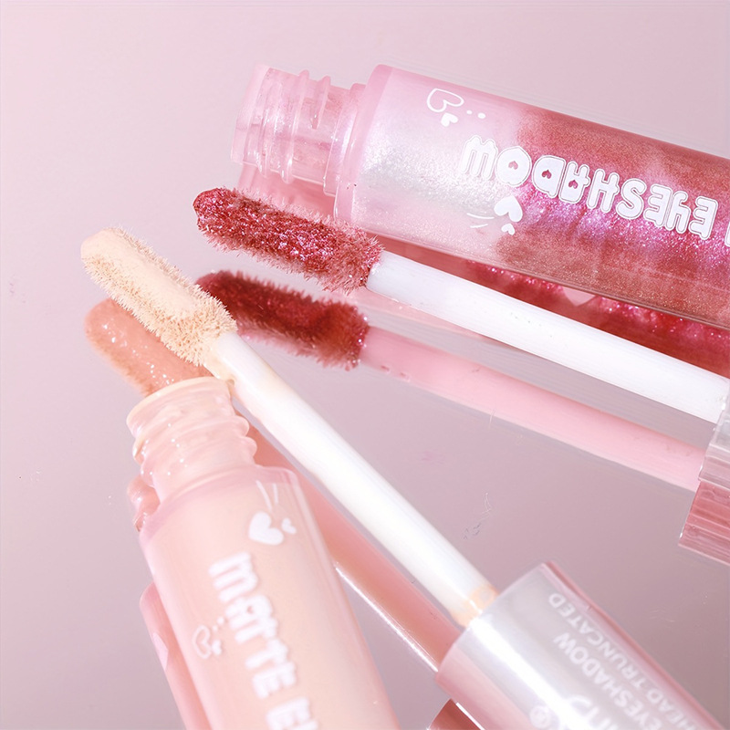 USHAS Sombra de ojos de doble cabeza de punto transfronterizo europeo y americano, brillo fino, sombra de ojos líquida impermeable de gusano de seda de alto brillo LG2591