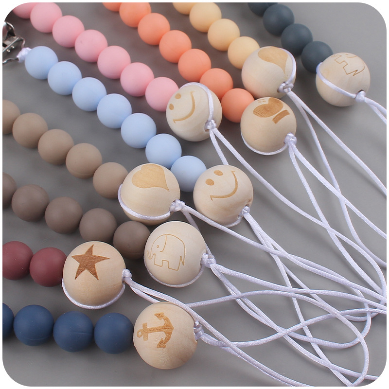 Nuevos suministros para bebés clip de chupete de haya creativo bebé DIY patrón de dibujos animados cuentas de madera Cadena de chupete cadena anti-caída