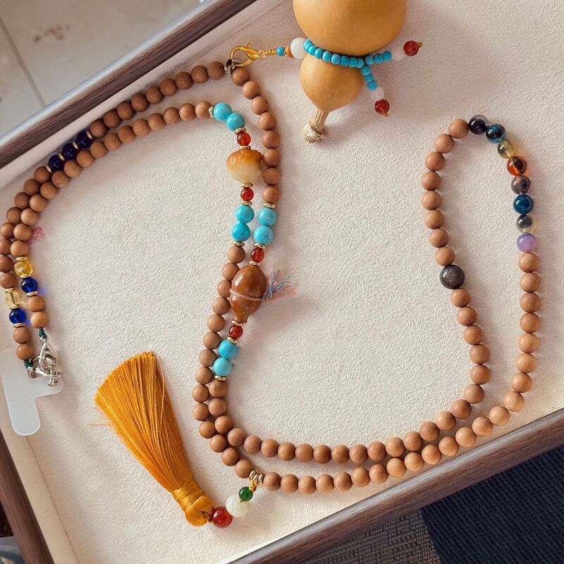 Chinese-style sandalwood crossbody chain necklace with gourd and multi-bead design, a unique and artistic long necklace for wearing with a cheongsam Chinese-style sandalwood crossbody chain necklace with gourd and multi-bead design, a unique and artistic long necklace for wearing with a cheongsam