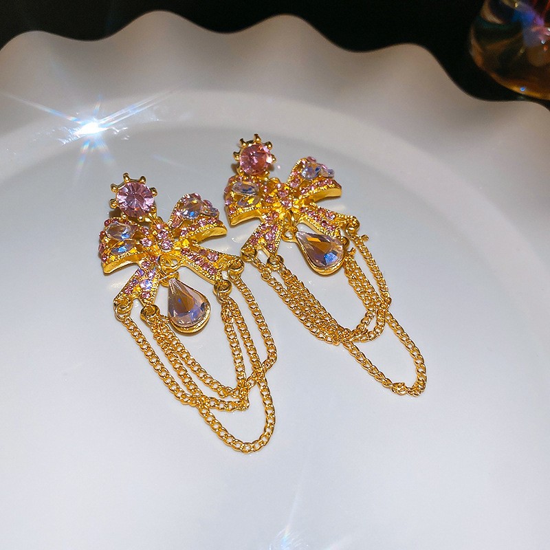 Aguja de plata Pendientes de lazo de diamantes coreanos Pendientes de temperamento de moda de todo fósforo Pendientes de diseño de nicho Sentido de lujo ligero