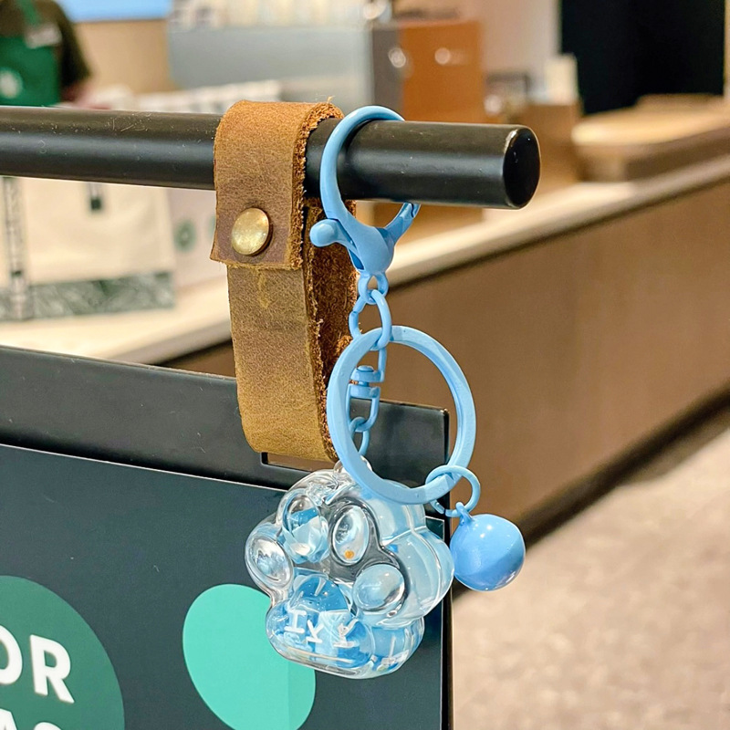 Caricatura en aceite líquido arena flotante botella mochila llavero delicado colgante accesorios accesorios máquina de muñecas pequeños regalos al por mayor