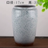Dark gray pottery, tight mouth, white old pile
