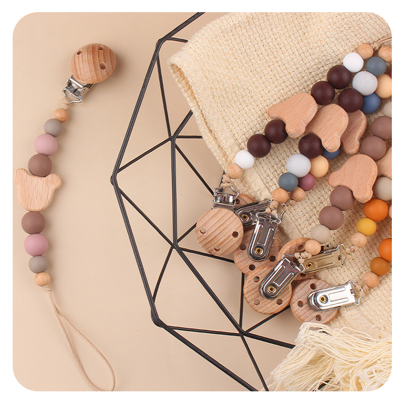 Productos para bebés y niños abrazadera de chupeta creativa caricatura bebé oso cabeza de beech mordida cadena de chupeta de dientes molares anti-caída cadena