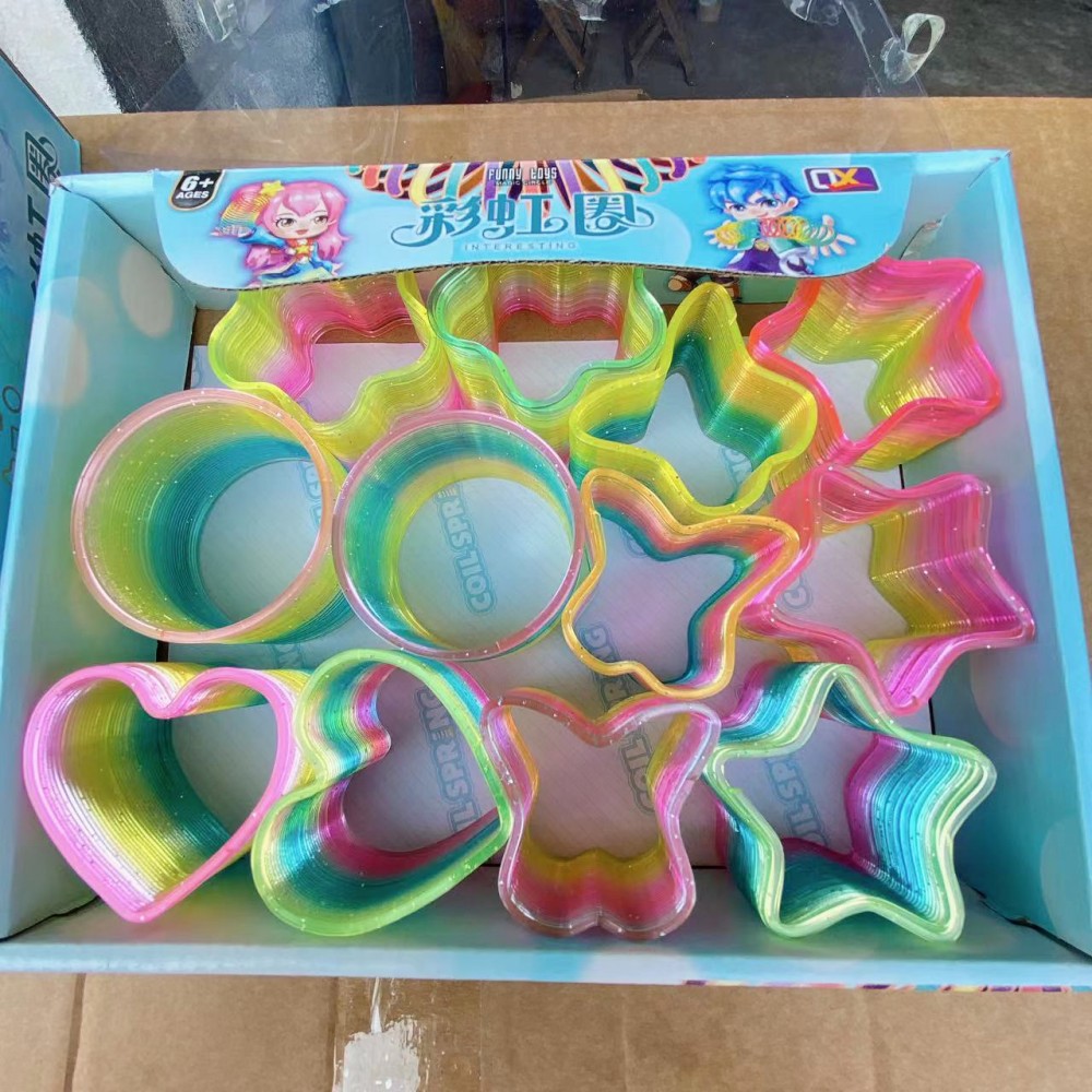 Juguete para niños anillo de arco iris elástico al por mayor primavera educativa anillo apilado gran cristal mezclado descompresión del cabello tienda departamental