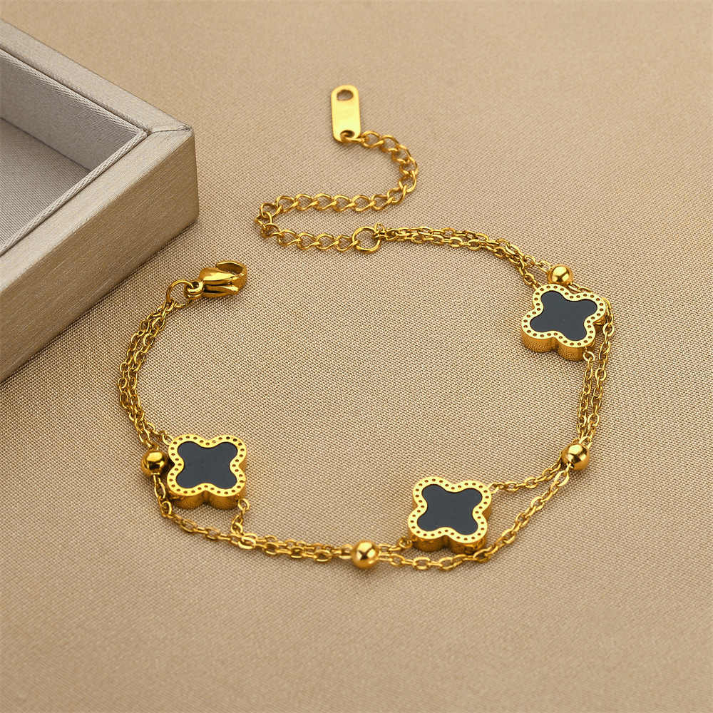 Ventas transfronterizas calientes de acero de titanio negro y blanco pulsera de cuatro hojas de doble capa de cadena de bola de acero oro rosa nicho de alta calidad joyas de pulsera