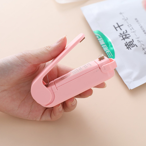 Portable mini sealing machine creative household food plastic bag opening sealing machine travel hand pressure heat sealing machine