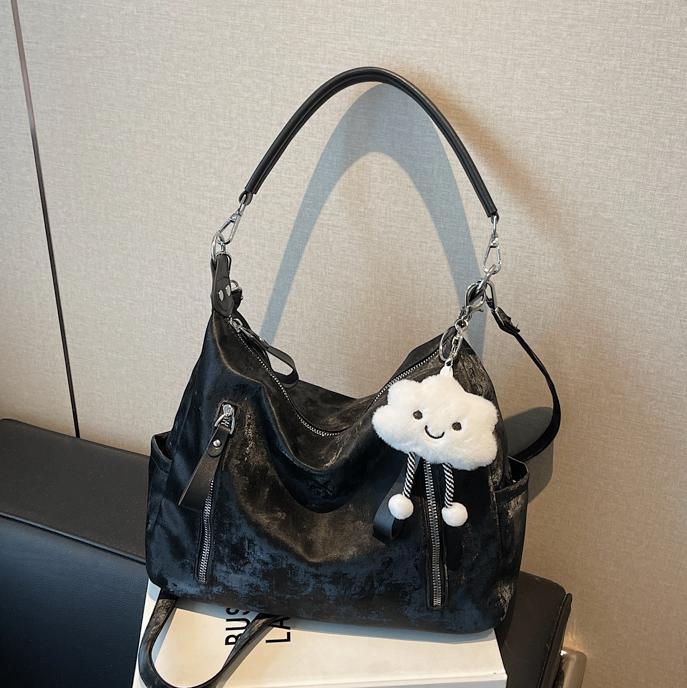 Bolsa suave Pitot para mujeres de gran capacidad 2025 nueva alta sensación de bolso de mano de viaje simple mochila de bolsillo casual