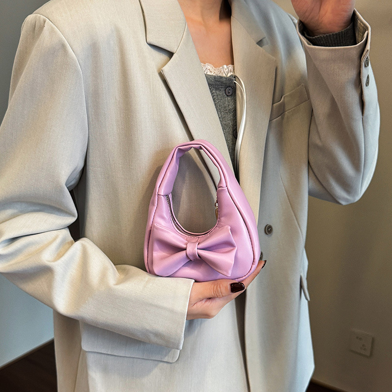 Dolce y lindo arco bolso de niña exquisita mini bolso de cambio de bebé 2025 bolso infantil transfronterizo
