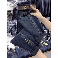 梨の形の体つきの大きいサイズのハーレムのジーパンの女性2025新型の春秋の太っているmmの弾力はやせている9分のお父さんのズボンを現します。