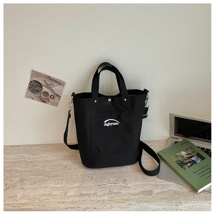 Bolso de mano de gran capacidad para mujeres 2026 verano nuevo estilo coreano simple mochila de hombro de viaje bolsa de ocio