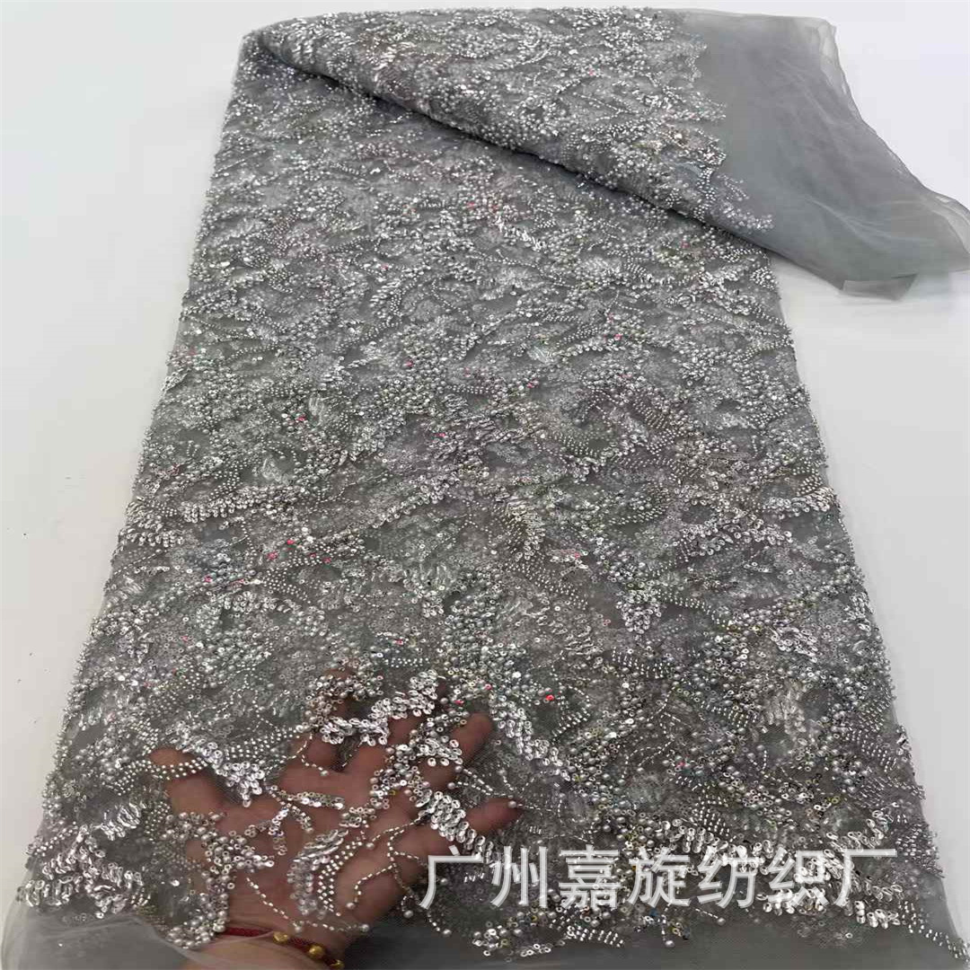 Tela de encaje francés con lentejuelas y cuentas bordadas en tubo con un exquisito patrón irregular al estilo francés para vestido de novia.