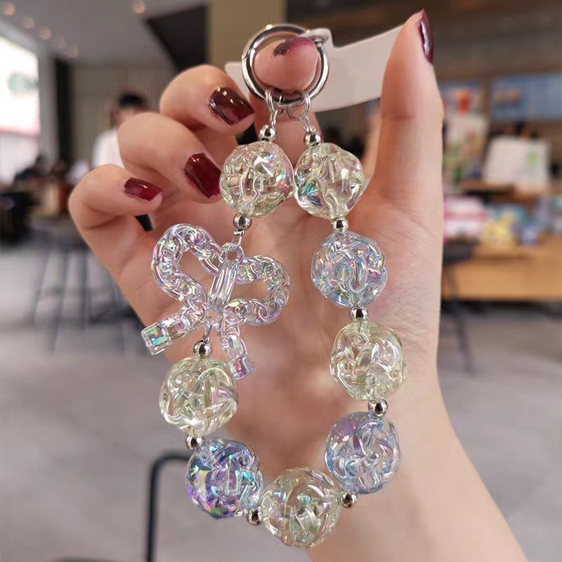 Colgante de teléfono móvil corto colgante de muñeca red rojo patrón delicado arco colgante de cuentas caja de teléfono móvil anti-perdida universal