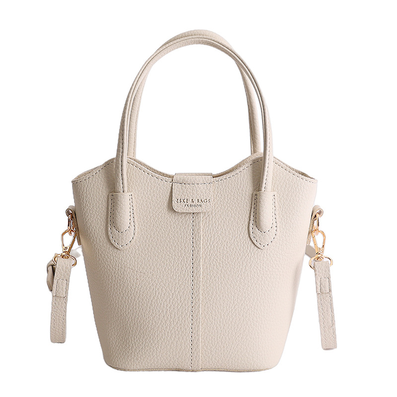 Bolso de mano de moda retro 2026 nuevo temperamento simple bolso de cubo de viaje ocio mochila de hombro