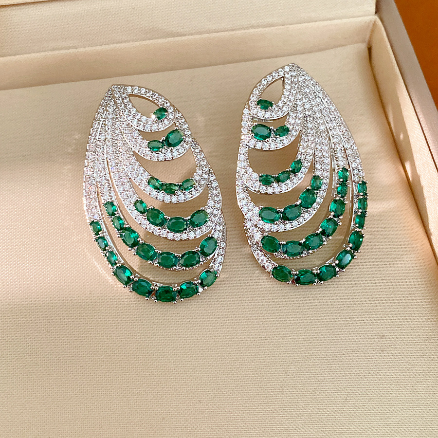Aguja de plata zircon oval multicapa personalidad temperamento nicho pendientes de moda ligero lujo alta sensación auriculares al por mayor