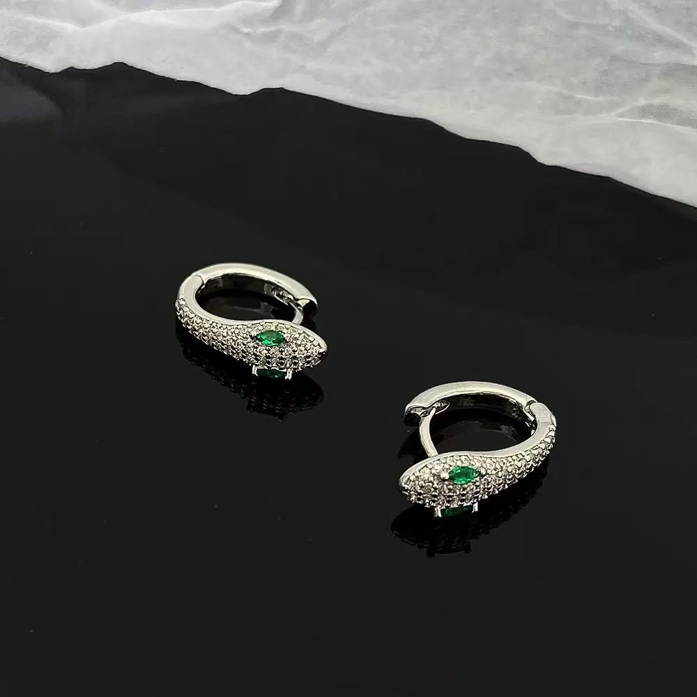 El diseño de nicho de los auriculares en forma de serpiente europeas y estadounidenses transfronterizos es único, lujoso y exquisito, auriculares de moda universal.