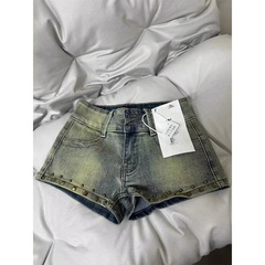 アメリカのギャルのレトロなデニムの半ズボンの女性の夏の薄いタイプのデザイン感の柳の釘の低い腰の半ズボンはお尻の熱いズボンの子供を包みます。