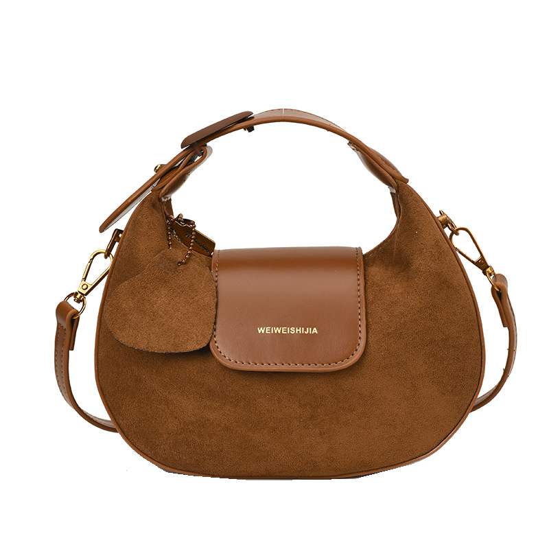 2025 otoño y invierno nueva moda alta sensación de cuero esmerilado empalme bolso de media luna exquisito de moda bolso versátil