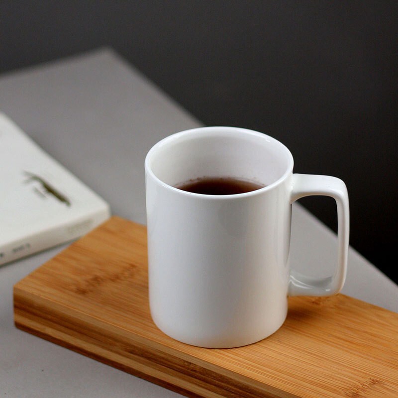 Tangshan pure white irregular-shaped ceramic mug, water cup, home-use cup, milk breakfast cup, bone china cup with logo printed Tangshan pure white irregular-shaped ceramic mug, water cup, home-use cup, milk breakfast cup, bone china cup with logo printed