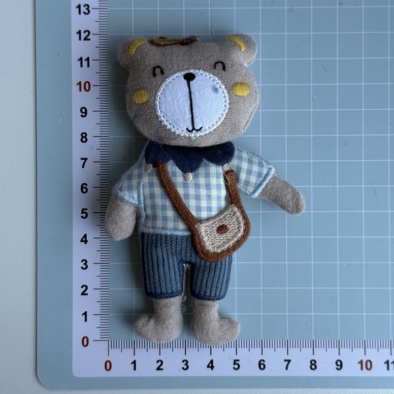 新しい布芸のかわいい蝶結びのマフラーの熊の包みのブローチの髪飾りは漫画のDIYの服装の補助材料を飾ります。|undefined
