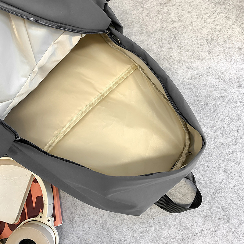 Nueva mochila de alta capacidad de la moda fresca de color sólido bolsas de viaje de estudiantes de secundaria secundaria ocio simple mochila de computadora