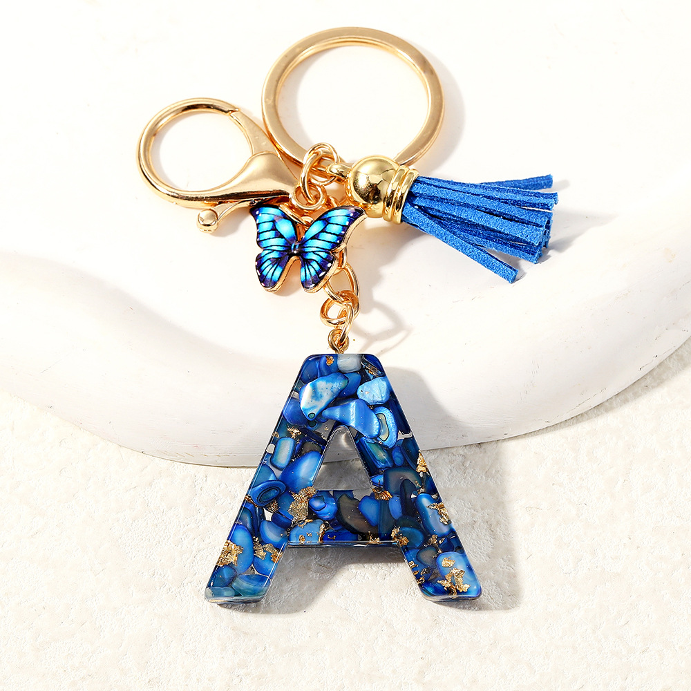 Nuevo transfronterizo mariposa 26 letras inglesas de cristal goteo llavero bolsos accesorios colgante de automóviles