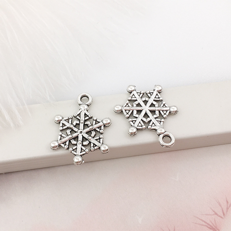1 copo de nieve aleación colgante DIY aleación joyería brillante plata hueco copo de nieve colgante transfronterizo Amazon Venta caliente