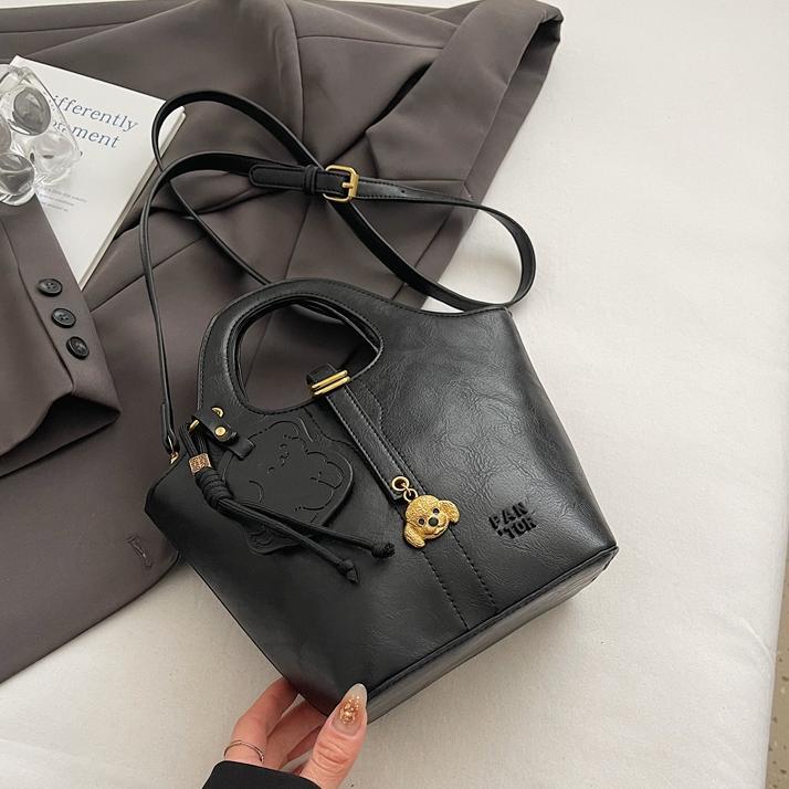 Moda coreana portátil bolso de cubo de agua para mujeres 2025 nuevo nicho simple bolso de hombro de alto nivel bolso de mochila versátil