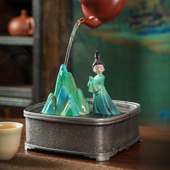 A light luxury home and office decoration, featuring a tea pet and pen holder, artfully designed to showcase the "Green and Blue of a Thousand Li" landscape in a unique and elegant manner.