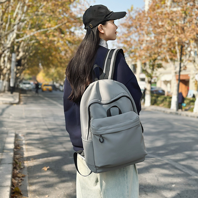 Las chicas japonesas de bolsos de lona son antiguas, impermeables, de color sólido, bolsos de nylon, Campus simple y versátil mochilas escolares para hombres de moda.