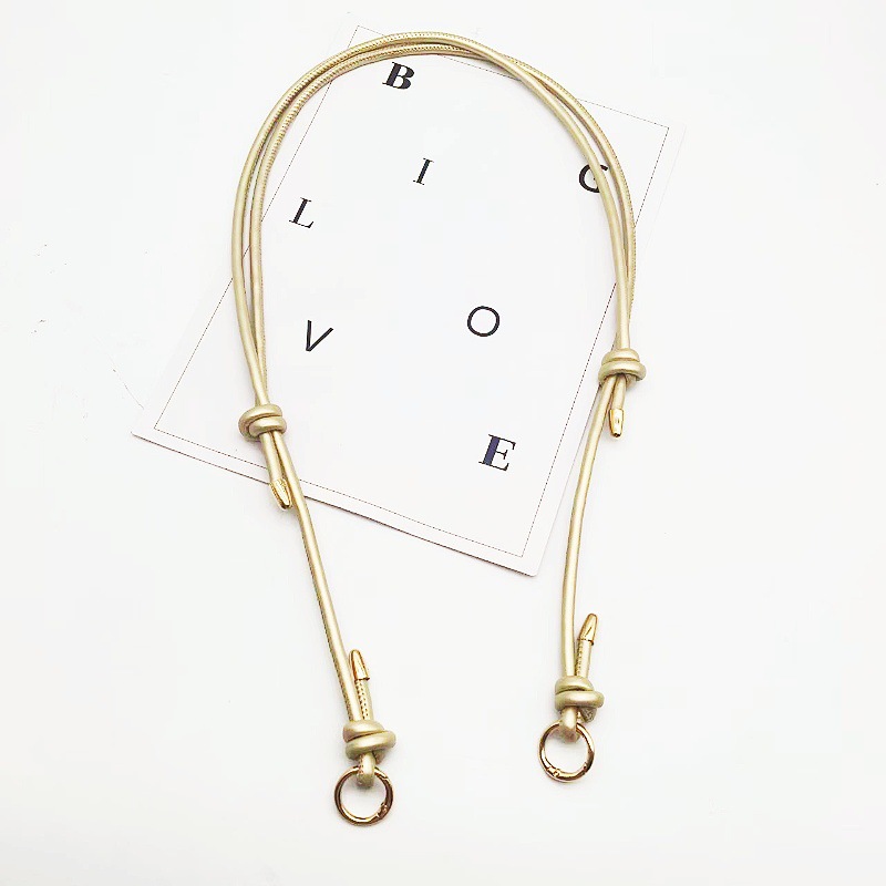 Gold shoulder strap with gold buckle