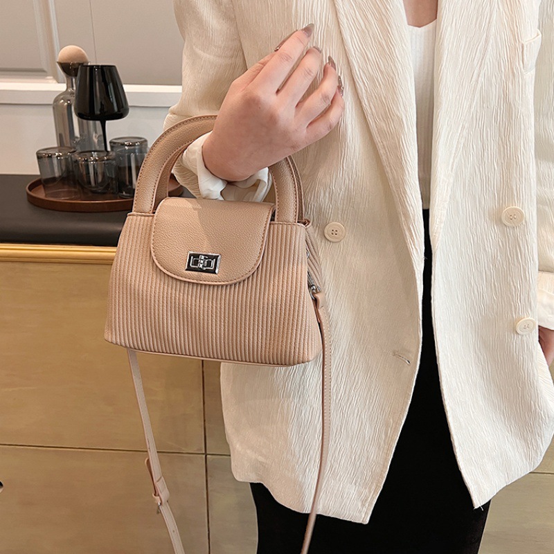 Bolso de moda coreano 2025 verano nuevo bolso femenino casual patrón de lichi bolso de hombro a rayas todo fósforo bolso de mensajero