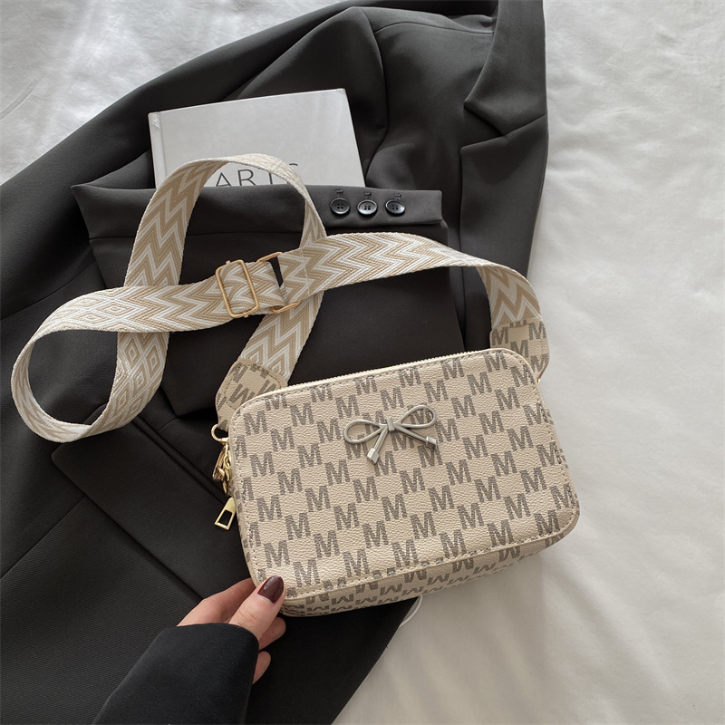 Bolso pequeño con textura de lazo para mujer 2025 primavera nuevo estilo popular bolso cuadrado pequeño con textura de alta calidad bolso de mensajero de un solo hombro