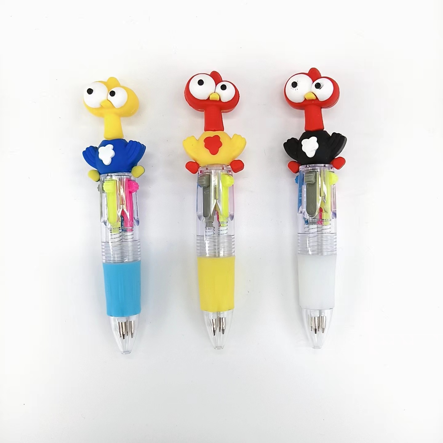 Fabricante mayorista de cuatro colores bolígrafo de silicona bolígrafo multicolor de dibujos animados cabeza portátil de estudiantes