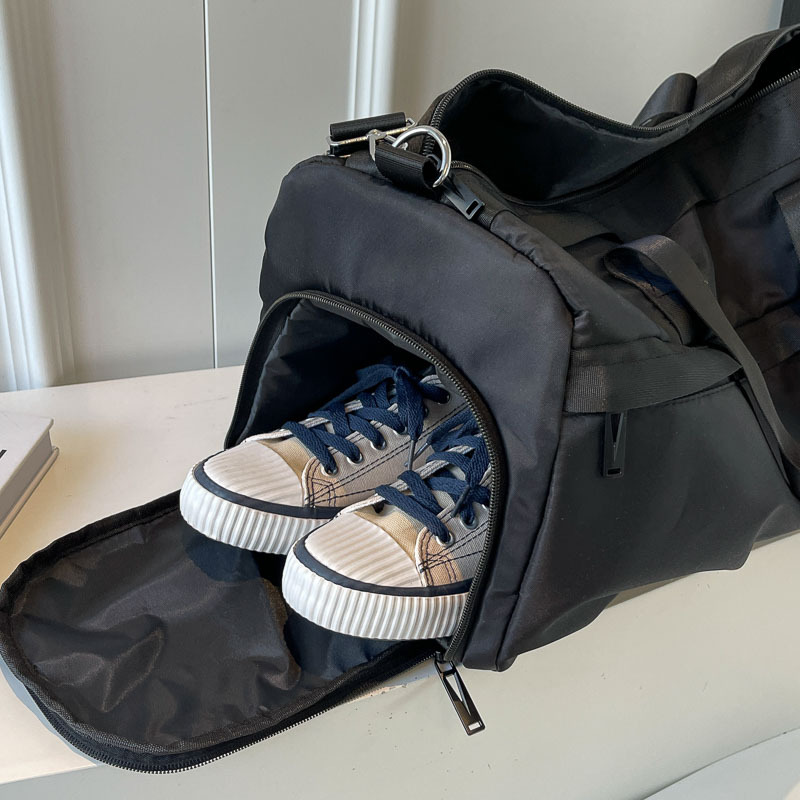 Bolsa de viaje de gran capacidad de corta distancia para mujer 2024 nueva bolsa de fitness deportiva ligera simple y versátil bolso de mensajero de un solo hombro para hombre