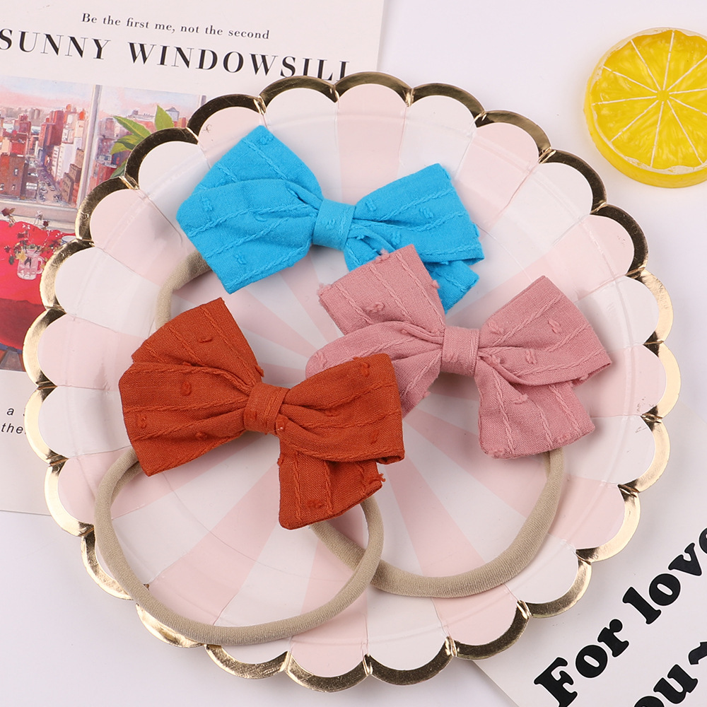 Europäische Und Amerikanische Kinder Bowknot Haarband Baby Baby Super Weiche Nylon Stirnband Süßigkeiten Farbe Haarschmuck Großhandel display picture 3