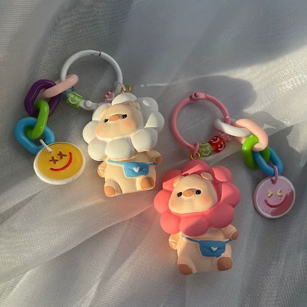 Super cute sunflower pig keychain ring Cartoon Doll schoolbag bag pendant earphone case accessories versatile