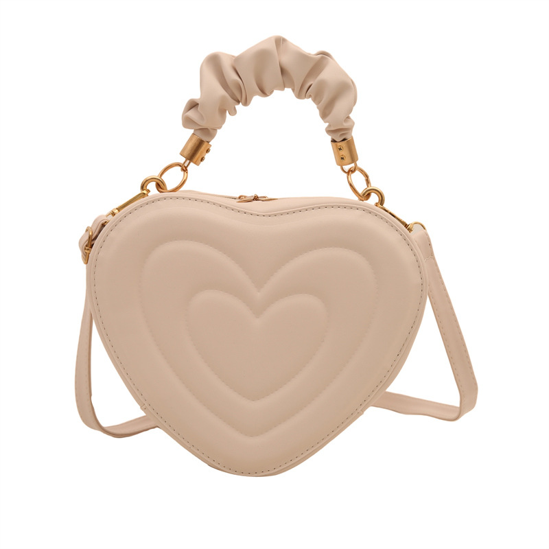 2024 otoño y invierno de mujeres nuevas caramelo de cáscara dura bolso de hombro de color corazón bolso de moda bolso de amor amor amor impresión