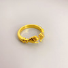 Adjustable brass fashionable ring, 18 carat, on index finger