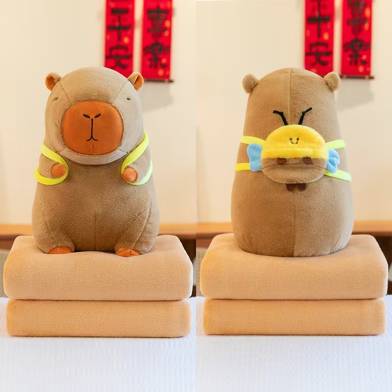 Caricatura capibara almohada manta dos en uno Carpibara cojín aire acondicionado es de doble uso niños siesta manta regalo