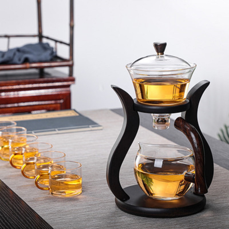 Fábrica al por mayor Palacio lámpara juego de té de vidrio borosilicato fabricante de té perezoso Kung Fu juego de té traje de succión magnética juego de té