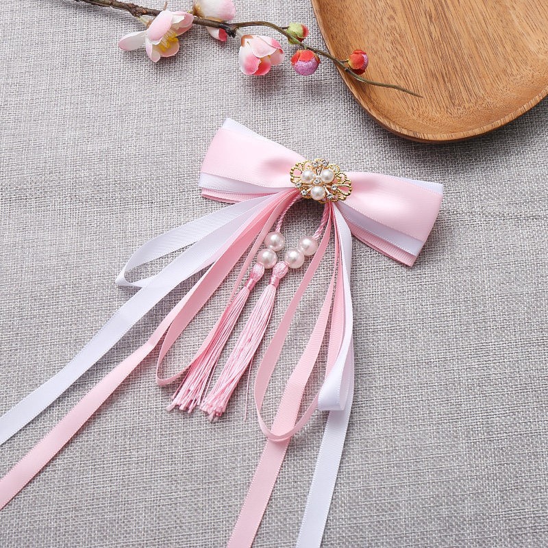 Fuchsia hairgrip with bow pearl