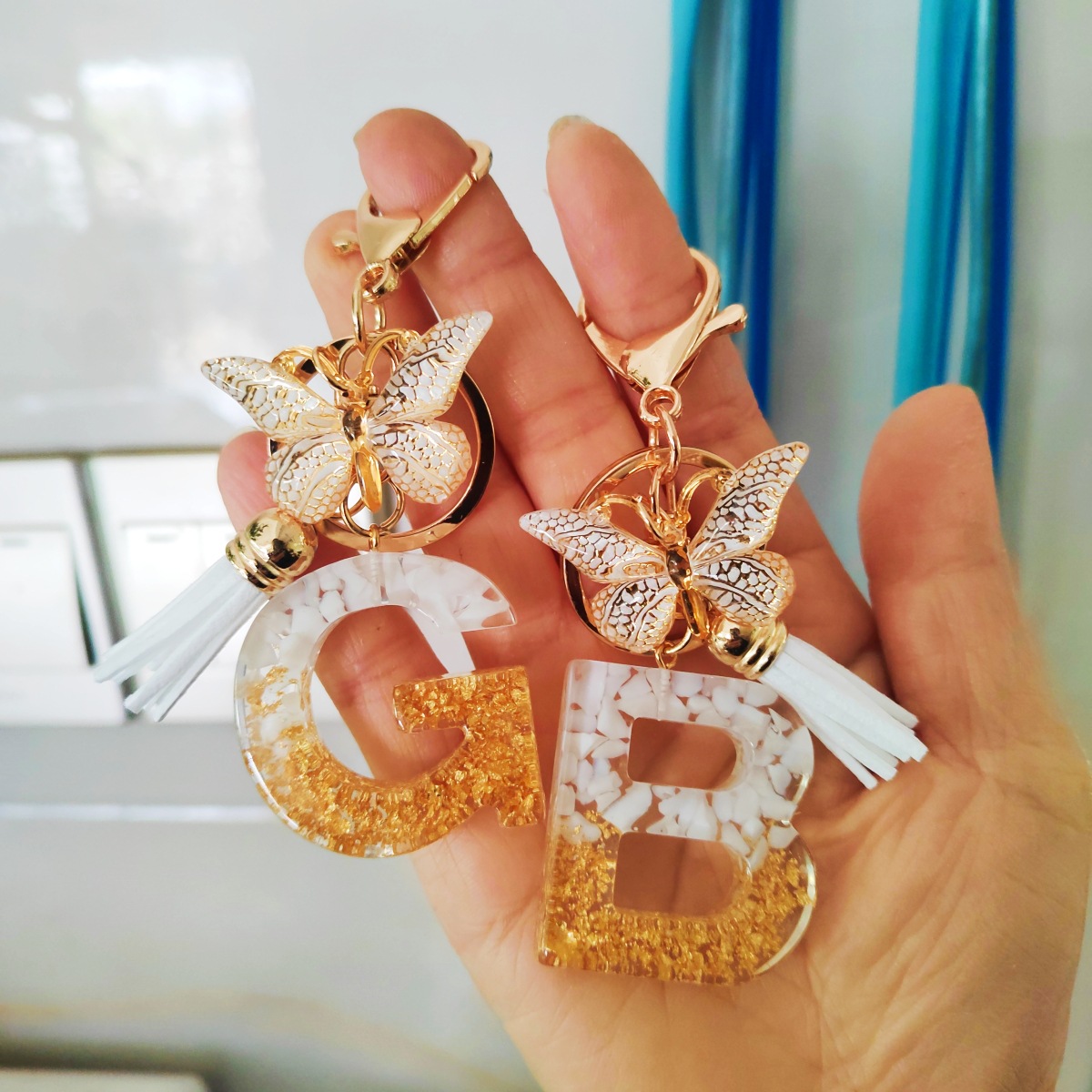 Venta caliente transfronteriza e-commerce carta llavero colgante europeo y americano moda joyería accesorios mariposa borla clave colgante