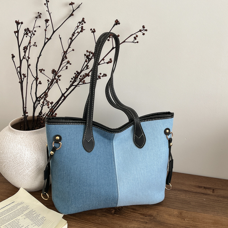 Bolsa de mano de gran capacidad para mujeres 2026 nueva moda jeans empalme color contraste bolso de hombro de viaje simple bolsa de mano