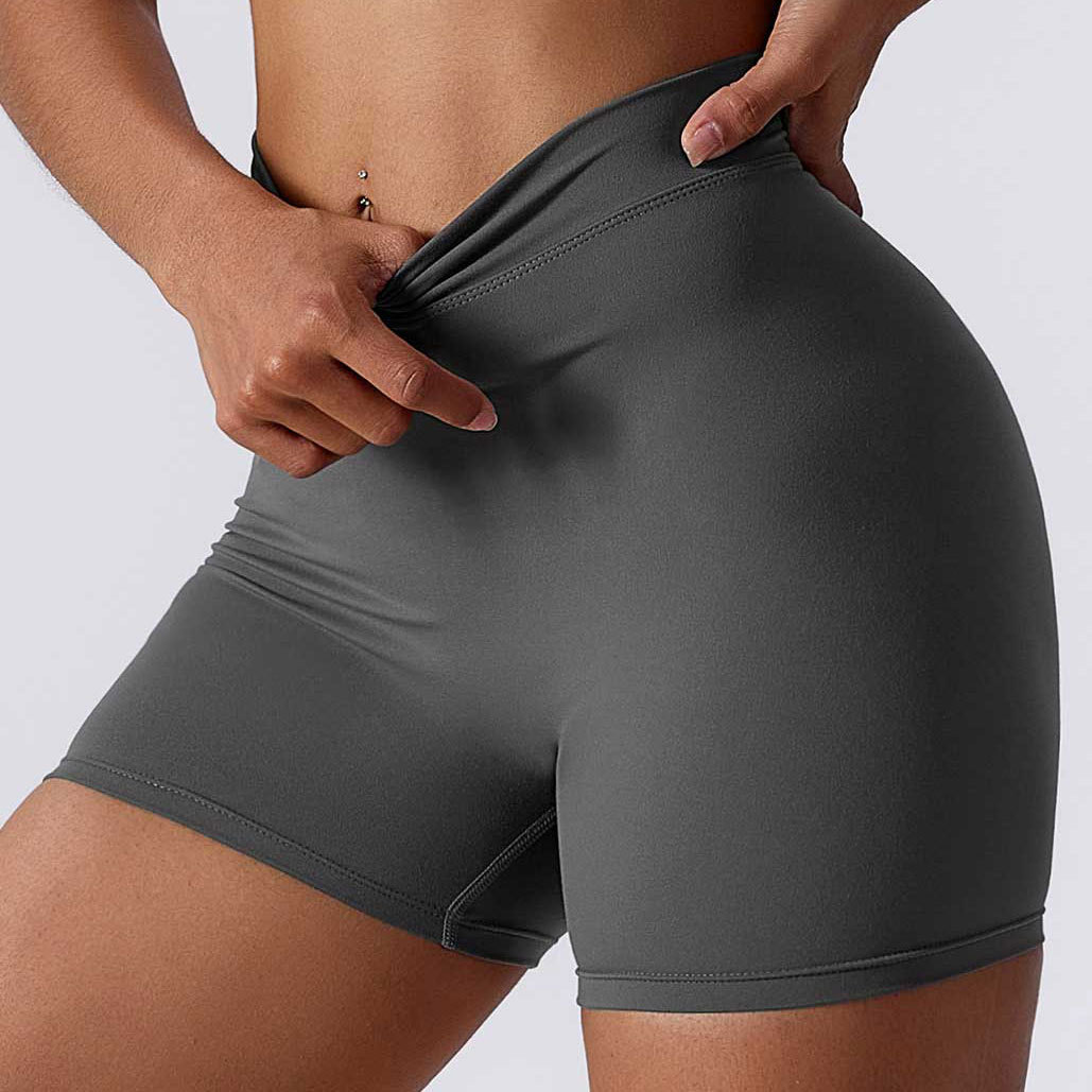 Color sólido cintura espalda V arrugas cadera elevación desnuda pantalones de tres puntos pantalones de yoga elásticos transpirables pantalones cortos de fitness de secado rápido para mujeres