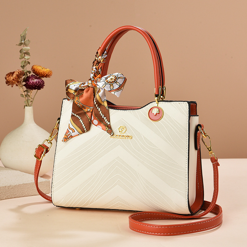 Bolsas de mujer transfronterizas 2025 nueva moda relieve bolsas de mano de gran capacidad bolsas de madres de mediana edad bolsas de hombro mochila