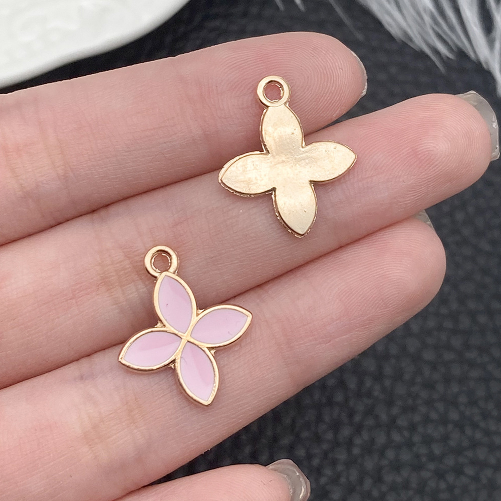 1 Trébol de cuatro hojas de flores cuadrangulares con gotas de Aceite Rosa 11x15mm - 17510 - 0,7g