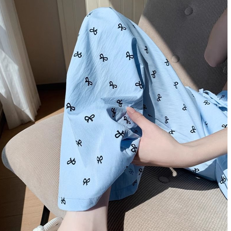 Cuatro estaciones pijamas primavera y otoño dulce delgamiento correa de impresión de arco de verano pantalones largos de invierno pantalones caseros se pueden usar al por mayor