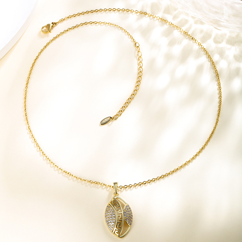 Xuping moda bronce dorado galvanoplastia piedra geometría colgante ovalado muralla mujer patrón retrógrado colgante nicho